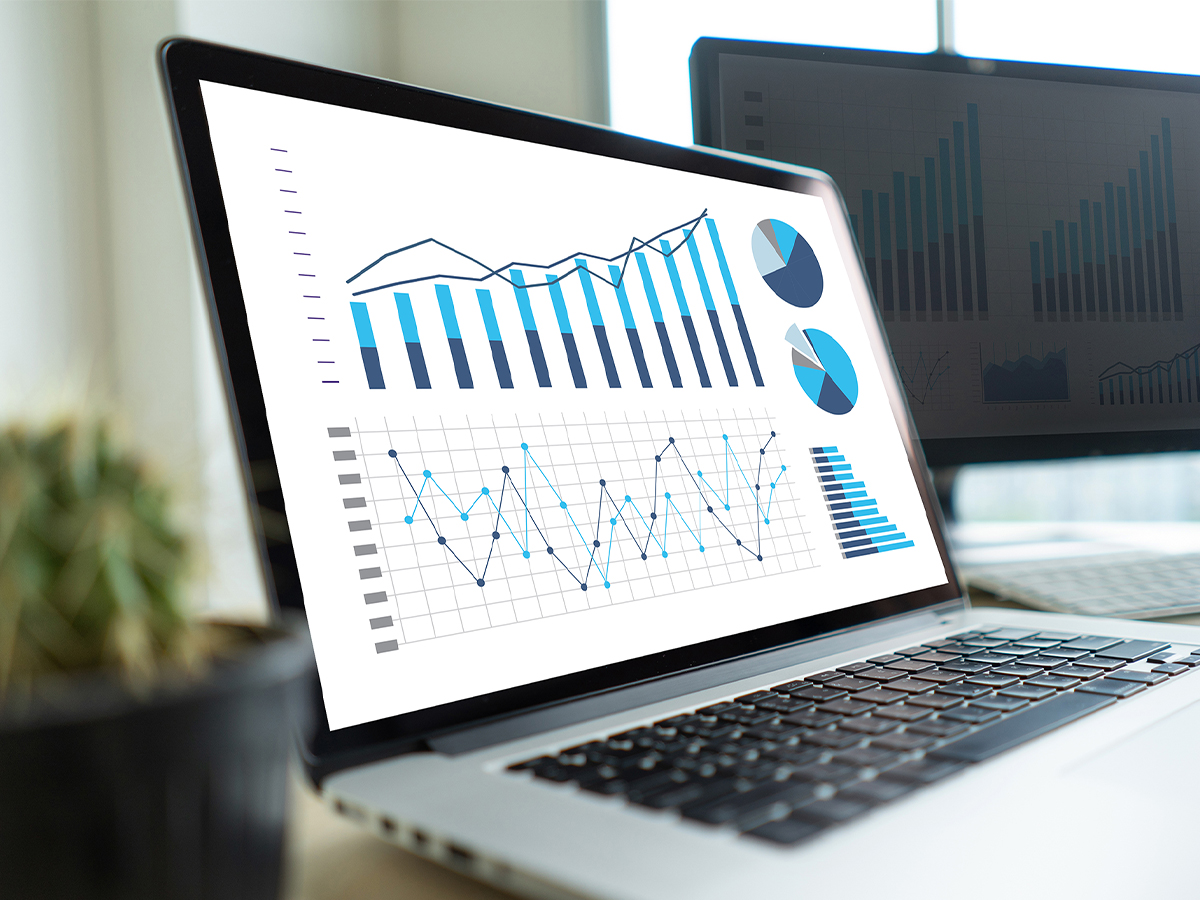 laptop computer with data charts and graphs